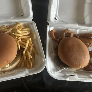 Burger with fries and other with onion rings