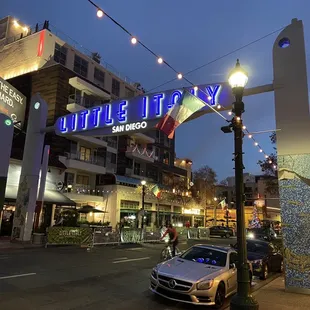 The shop is right in front of the little Italy sign