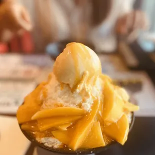 a scoop of mango ice cream