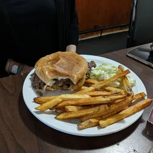 a burger and fries on a plate
