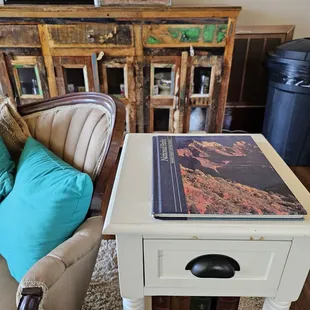a side table with a book on it