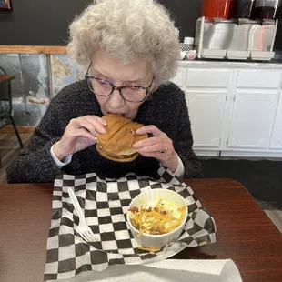 a woman eating a sandwich