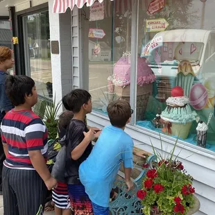 Grandchildren drooling at the window