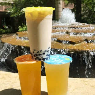 Regular green milk tea (top), mango tea with mango pieces (left), lychee green tea (right)