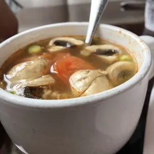 a bowl of soup with a spoon in it