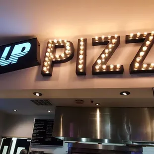 neon sign above counter