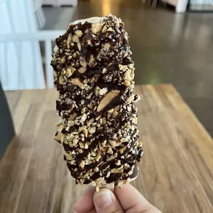 Vanilla PopGelato with dark chocolate, waffle cone and toffee, and carmel dark chocolate drizzle