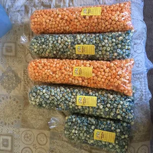 These are the large popcorns that are $11/bag. &amp; the small one is extra popcorn he had.