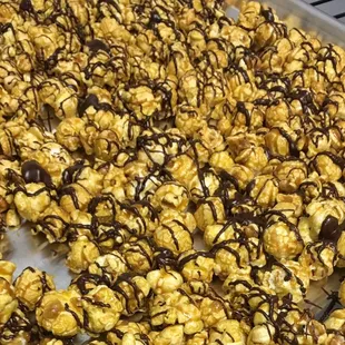 a tray of popcorn covered in chocolate