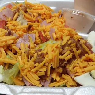 Chef salad with thousand island dressing.