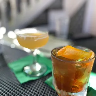 two cocktails on a table