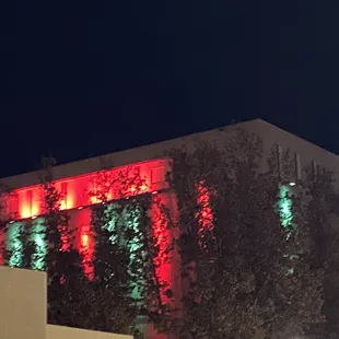 red and green lights on the side of the building