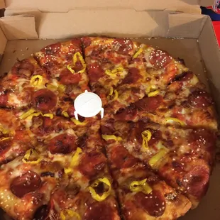 Stuffed crust pizza with cheese, pepperoni, sausage, bacon, yellow pepper to spice it up &amp; a garlic butter, sesame seed crust!  FABULOUS!!