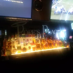 a bar with a lot of bottles of liquor