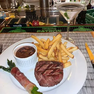 a steak and fries on a plate