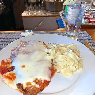 a plate of lasagna and pasta