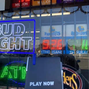 a neon sign in front of a store