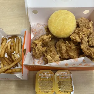 Chicken tenders, Cajun Fries, biscuit, wild honey mustard