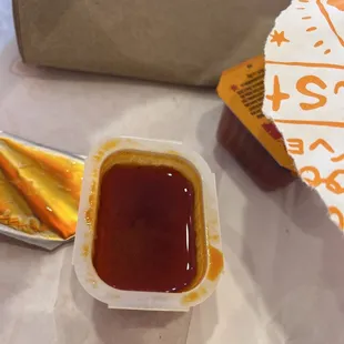 a hot dog with ketchup and mustard