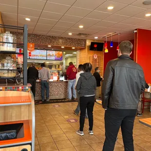 a group of people in a fast food restaurant