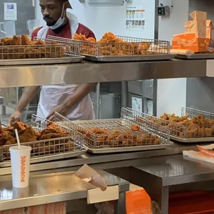 watched this guy with no gloves or hands touch chicken.  This is also the guy that was sweeping and touching food without washing.