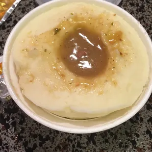 Mashed potatoes with a small dot of gravy