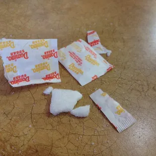 ewww solidified sugar packs that apparently sponged up some mystery liquid and then dried out.  gag!