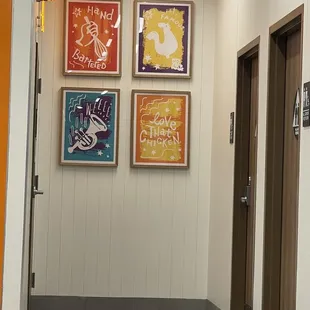 a hallway with posters on the wall