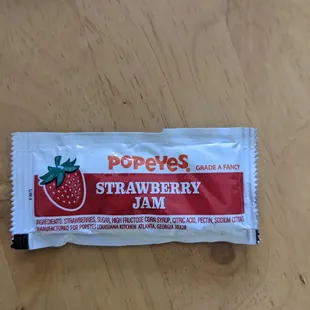 Strawberry  and  jam are available for those buttery biscuits.