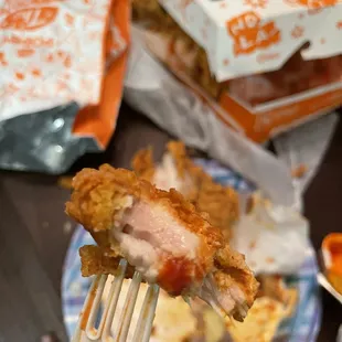 Raw frozen chicken in the center