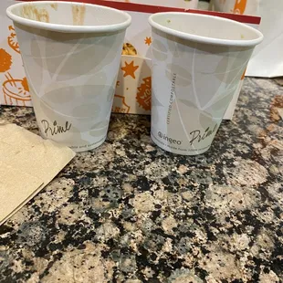 two cups of coffee on a counter