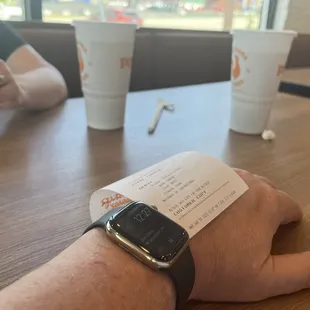 a person&apos;s wrist with an apple watch on it