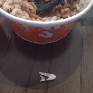 a bowl of rice and a spoon