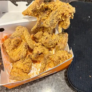 12 piece all dark spicy chicken , in the box, 8 wings and a back? Also got 2 breasts and one leg.  Do it correctly.  It is just sad.