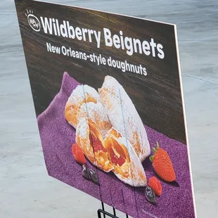 a sign for a new orleans style doughnuts