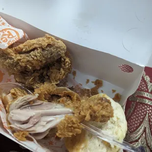 a fried chicken sandwich in a box