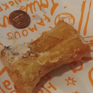 Chocolate beignet - penny for scale