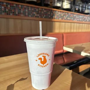 a plastic cup with a straw