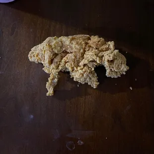 Deep fried piece of breading that looks like a rat