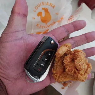 Cajun fried pigeon wing next to my key fob