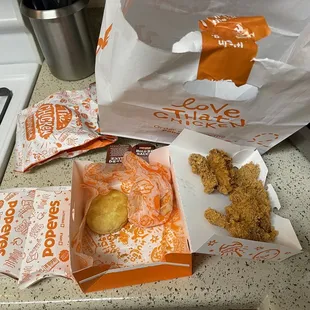 a bag of chicken nuggies and a bag of fried chicken nuggies