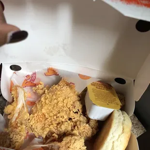 a fried chicken meal in a box