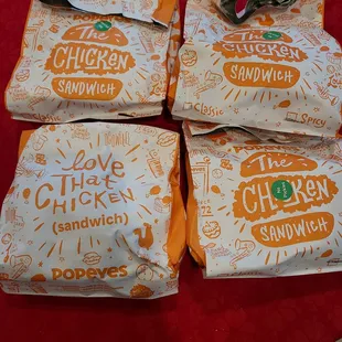 four bags of chicken sandwiches