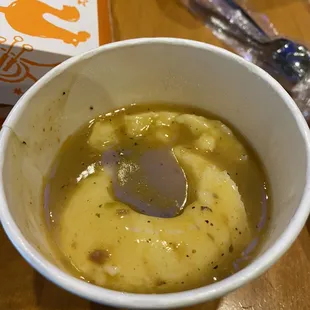 a bowl of soup with a spoon in it