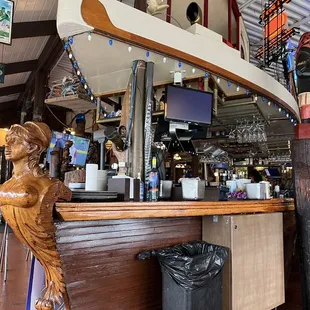 a statue of a woman at the bar