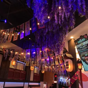 purple flowers hanging from the ceiling