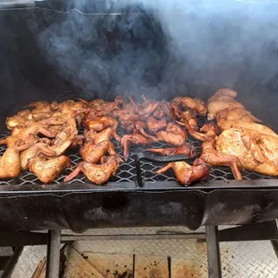 a grill with chicken on it