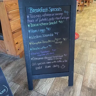 Breakfast specials on a board inside the entrance
