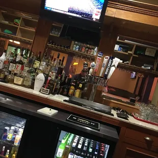 a bar with a television in the background