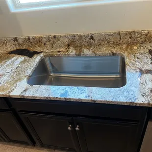 a kitchen counter with a sink